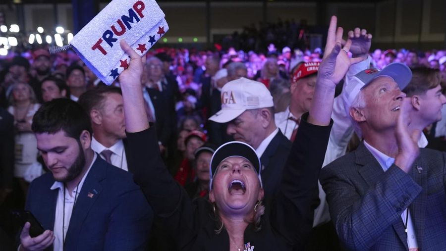 Supporters watch returns at a campaign election night watch party for Republican presidential nominee former President Donald Trump at the Palm Beach Convention Center, Wednesday, Nov. 6, 2024, in West Palm Beach, Fla. (AP Photo/Evan Vucci)