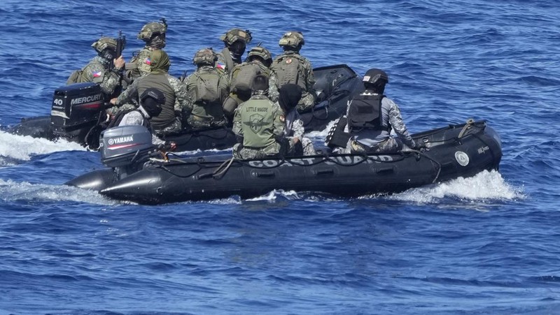 Philippine Navy Fast Attack Interdiction Craft Lolinato To-Ong passes by a Chinese Navy ship during a Philippine military multi-service joint exercise on Wednesday Nov. 6, 2024 at Loaita island locally called Kota island at the disputed South China Sea, Philippines. (AP Photo/Aaron Favila)