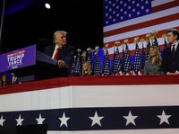 Republican presidential nominee and former U.S. President Donald Trump takes the stage with his wife Melania and son Barron to address supporters at his rally, at the Palm Beach County Convention Center in West Palm Beach, Florida, U.S., November 6,