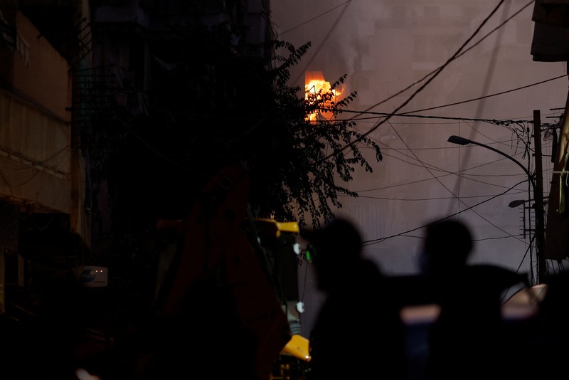 ISRAEL-PALESTINIANS/LEBANON Flames rise from a fire in a balcony following an Israeli strike in Beirut's Basta neighbourhood, amid the ongoing hostilities between Hezbollah and Israeli forces, Lebanon November 23, 2024. REUTERS/Adnan Abidi