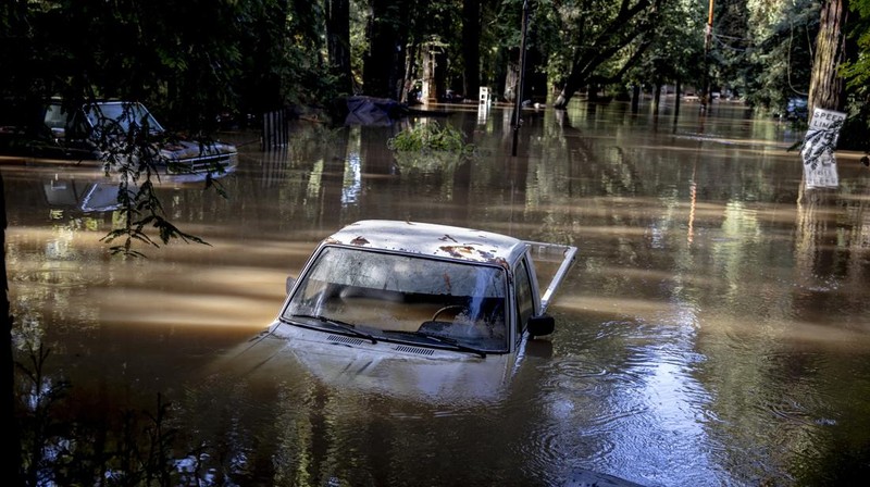 A car is seen submerged in flooded water at Mirabel RV Park & Campground after severe weather in Forestville, Calif., Saturday, Nov. 23, 2024. (Stephen Lam/San Francisco Chronicle via AP)