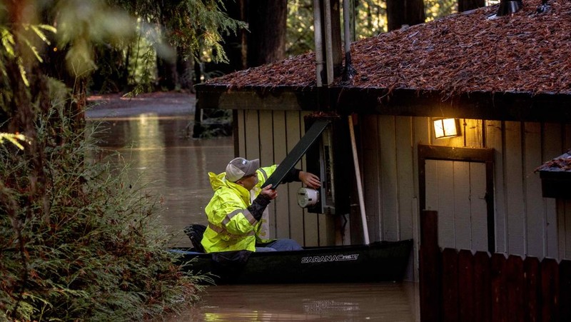 A car is seen submerged in flooded water at Mirabel RV Park & Campground after severe weather in Forestville, Calif., Saturday, Nov. 23, 2024. (Stephen Lam/San Francisco Chronicle via AP)