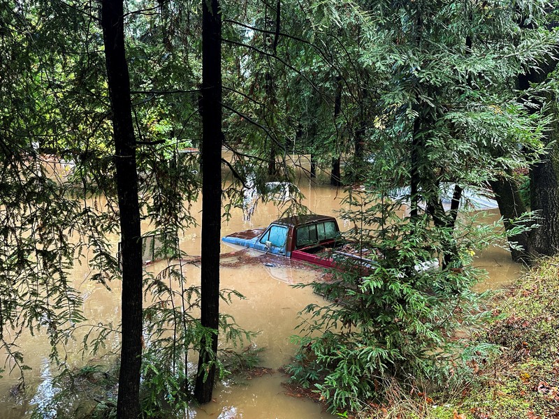 A car is seen submerged in flooded water at Mirabel RV Park & Campground after severe weather in Forestville, Calif., Saturday, Nov. 23, 2024. (Stephen Lam/San Francisco Chronicle via AP)