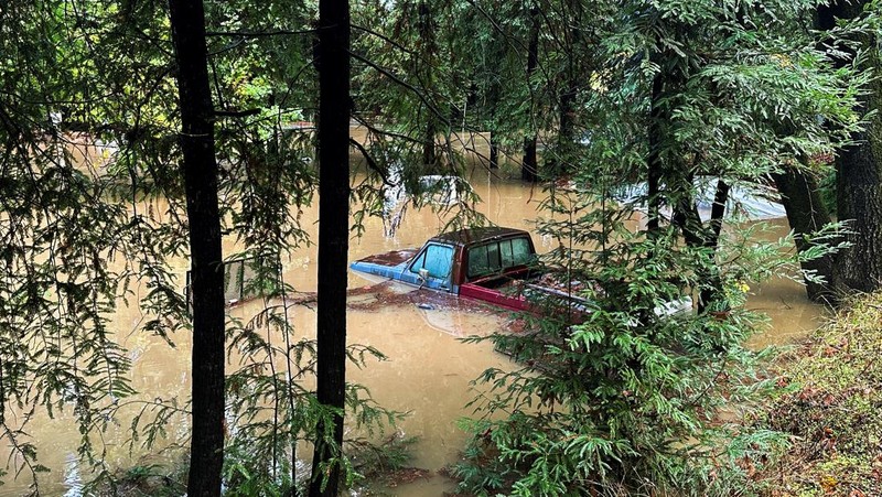 A car is seen submerged in flooded water at Mirabel RV Park & Campground after severe weather in Forestville, Calif., Saturday, Nov. 23, 2024. (Stephen Lam/San Francisco Chronicle via AP)