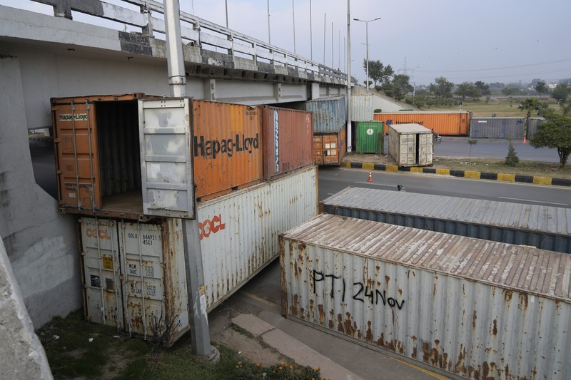 Paramilitary soldiers patrol as they station at a overhead bridge ahead of a planned rally by supporters of imprisoned former Prime Minister Imran Khan's Pakistan Tehreek-e-Insaf party, in Islamabad, Pakistan, Sunday, Nov. 24, 2024. (AP Photo/Anjum Naveed)