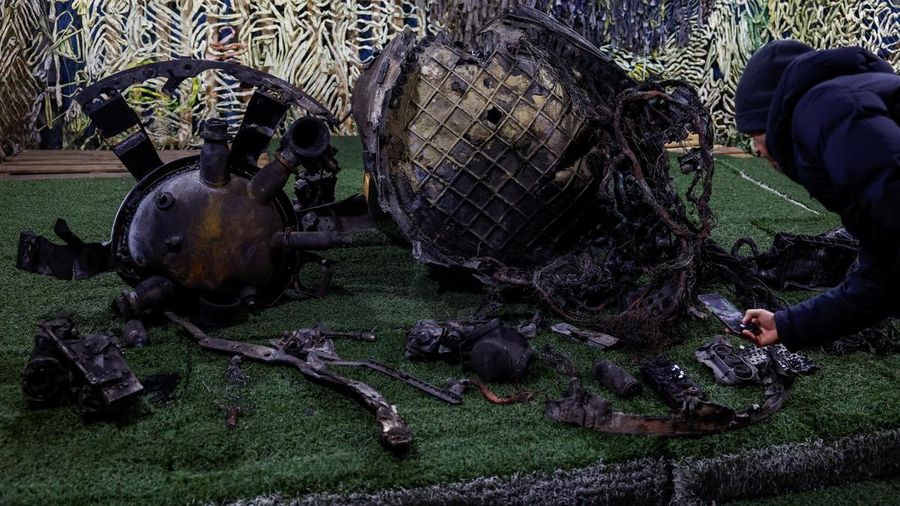 An investigator of the State Security Service of Ukraine (SBU) shows parts of a ballistic missile, which Russia used in a strike towards Dnipro city this week, amid Russia's attack on Ukraine, at an undisclosed location in Ukraine November 24, 2024. REUTERS/Valentyn Ogirenko     TPX IMAGES OF THE DAY