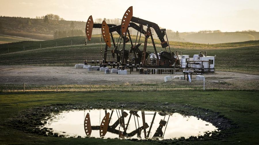 Trump Tariffs FILE - Pumpjacks draw out oil and gas from well heads as wildfire smoke hangs in the air near Calgary, Alberta, Sunday, May 12, 2024. (Jeff McIntosh/The Canadian Press via AP, File)
