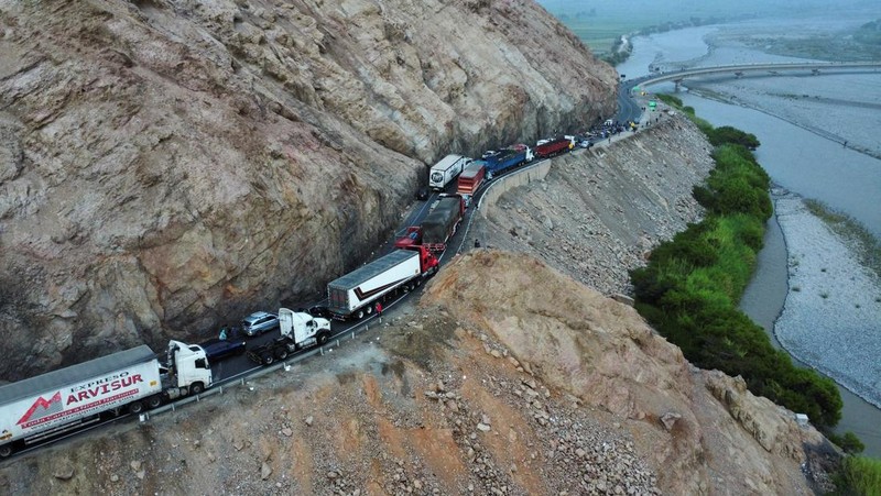 A drone image shows vehicles parked on a mountain road as small-scale miners halt traffic to demand the extension of a program that allows them to operate temporarily, but which authorities say has expanded illegal mining, in Ocona, Peru November 27, 2024. REUTERS/Oswald Charca