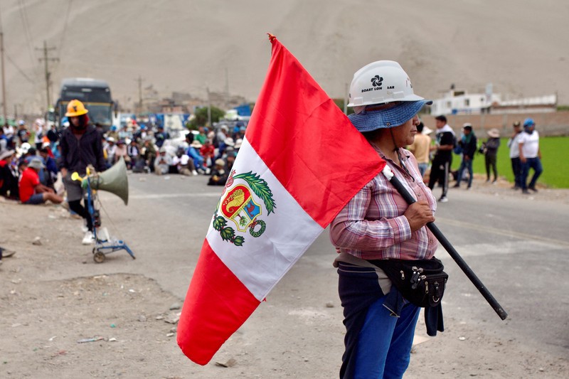 A drone image shows vehicles parked on a mountain road as small-scale miners halt traffic to demand the extension of a program that allows them to operate temporarily, but which authorities say has expanded illegal mining, in Ocona, Peru November 27, 2024. REUTERS/Oswald Charca