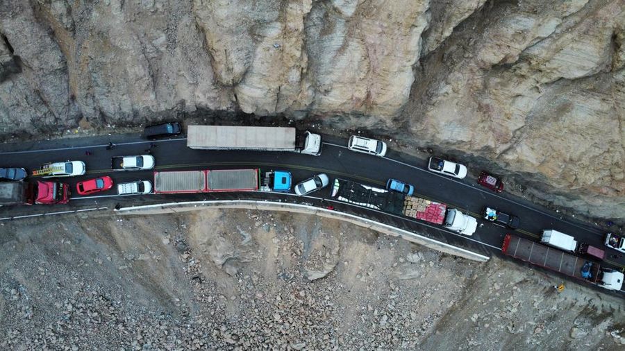 A drone image shows vehicles parked on a mountain road as small-scale miners halt traffic to demand the extension of a program that allows them to operate temporarily, but which authorities say has expanded illegal mining, in Ocona, Peru November 27, 2024. REUTERS/Oswald Charca