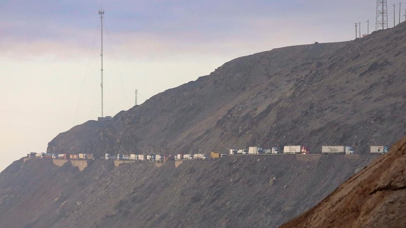 A drone image shows vehicles parked on a mountain road as small-scale miners halt traffic to demand the extension of a program that allows them to operate temporarily, but which authorities say has expanded illegal mining, in Ocona, Peru November 27, 2024. REUTERS/Oswald Charca