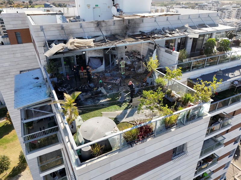 ISRAEL-PALESTINIANS/DRONE-STRIKE A drone view shows Israeli emergency services at the scene of a residential building which Israel's military said had been hit by a UAV that was likely fired from Yemen, in Yavne, Israel, December 9, 2024. REUTERS/Chen Kalifa Levi