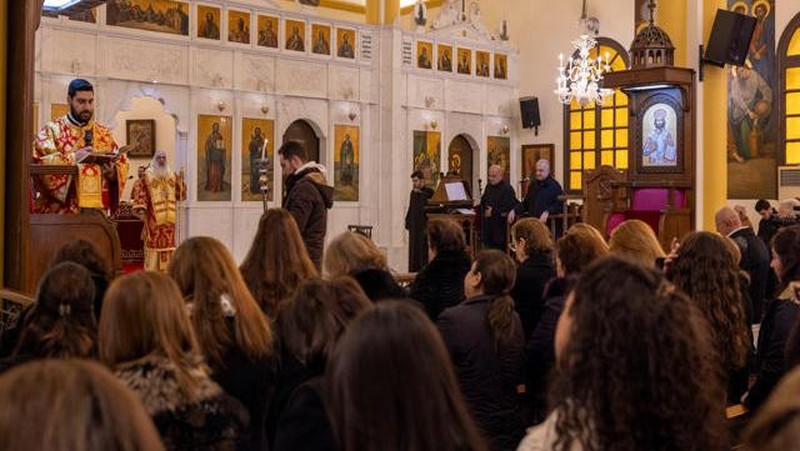 Members of the Orthodox community of Latakia attend a Sunday Mass conducted by Athanasios Fahed, Metropolitan of Latakia and its dependencies for the Greek Orthodox, at St. George's Cathedral in Latakia, Syria, December 15, 2024. REUTERS/Umit Bektas     TPX IMAGES OF THE DAY