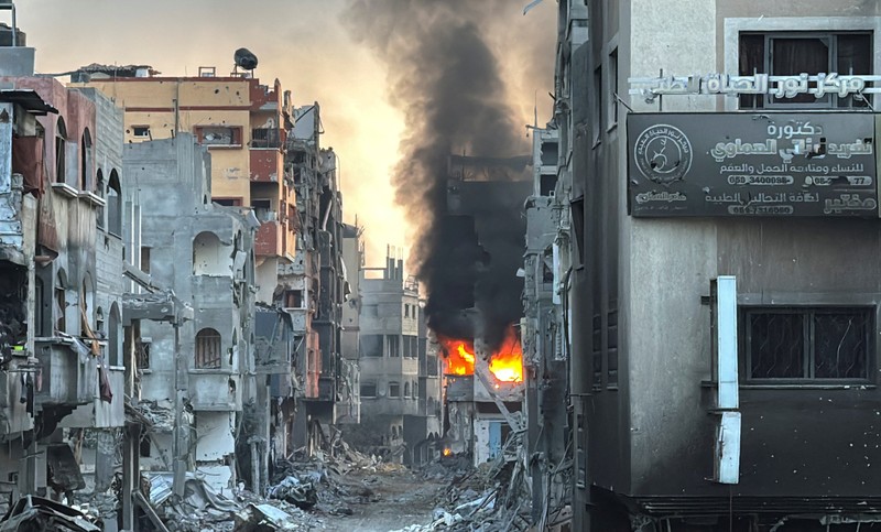 ISRAEL-PALESTINIANS/GAZA A fire burns inside a Palestinian house during the ongoing Israeli military operation, amid Israel-Hamas conflict, in Beit Lahiya, in the northern Gaza Strip, December 18, 2024. REUTERS/Stringer TPX IMAGES OF THE DAY