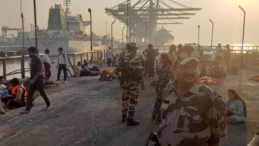 This handout photograph taken on December 18, 2024 and released by the Indian Coast Guard (ICG) shows Indian defence personnel carrying out rescue operation after an accident off the coast of Mumbai. An Indian navy speedboat undergoing tests in the busy seas off the financial capital Mumbai lost control and slammed into a ferry, killing 13 people, the navy and government said on December 18. (Photo by Indian Coast Guard (ICG) / AFP) / RESTRICTED TO EDITORIAL USE - MANDATORY CREDIT 