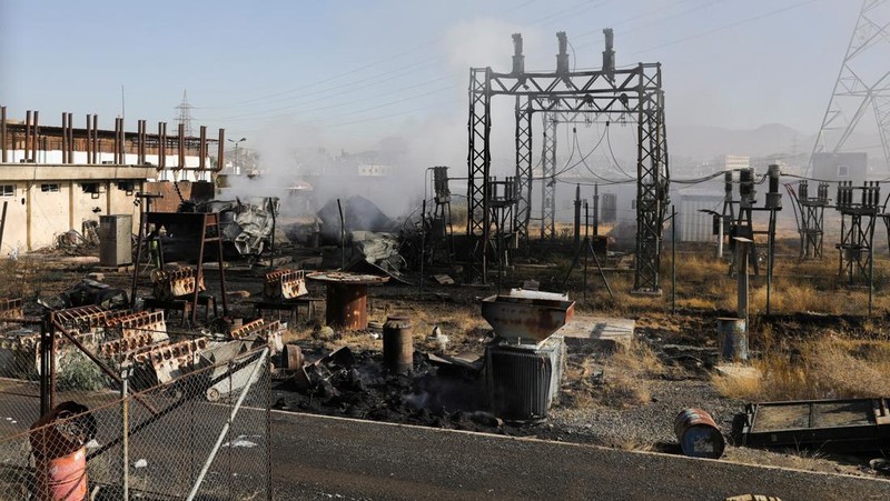 Smoke and flames rise from the premises of the Hezyaz Central generating station in Sanaa Governorate, Yemen in this screengrab obtained from social media video released December 19, 2024. Social Media/via REUTERS  THIS IMAGE HAS BEEN SUPPLIED BY A THIRD PARTY. NO RESALES. NO ARCHIVES.