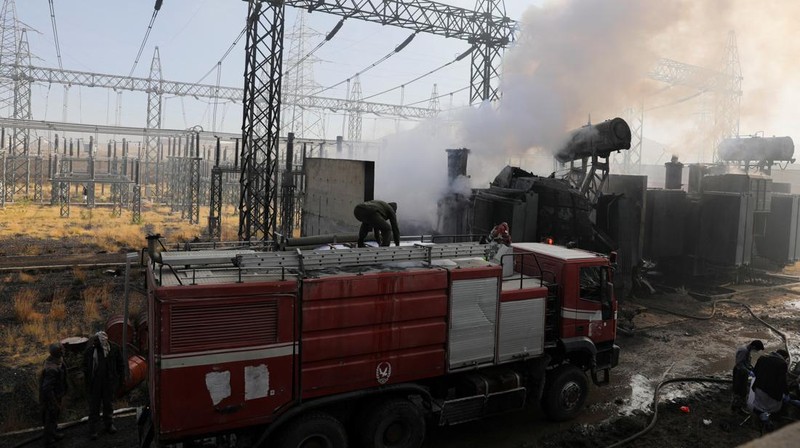 Smoke and flames rise from the premises of the Hezyaz Central generating station in Sanaa Governorate, Yemen in this screengrab obtained from social media video released December 19, 2024. Social Media/via REUTERS  THIS IMAGE HAS BEEN SUPPLIED BY A THIRD PARTY. NO RESALES. NO ARCHIVES.