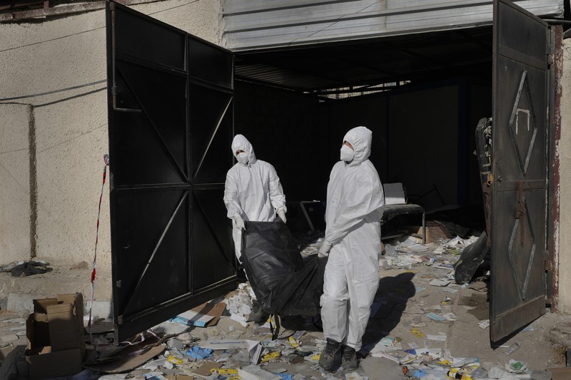 Syria A Syrian civil defense team, known as the White Helmets, inspects a morgue, previously used by pro-government Iranian units, located near the Set Zainab shrine, south of Damascus, Syria, on Wednesday, Dec. 18, 2024 (AP Photo/Hussein Malla)