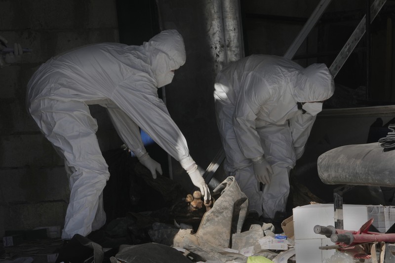 Syria A Syrian civil defense team, known as the White Helmets, inspects a morgue, previously used by pro-government Iranian units, located near the Set Zainab shrine, south of Damascus, Syria, on Wednesday, Dec. 18, 2024 (AP Photo/Hussein Malla)