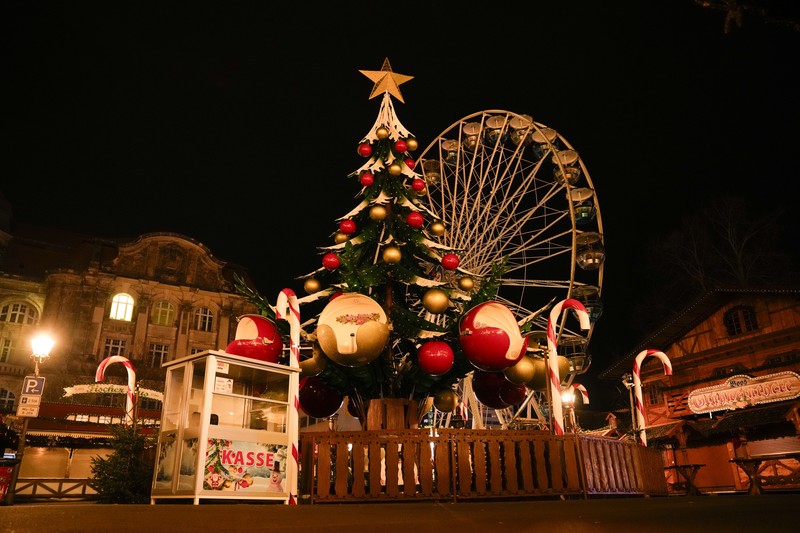Forensics work on a damaged car sitting with its doors open after a driver plowed into a busy Christmas market in Magdeburg, Germany, early Saturday, Dec. 21, 2024. (Hendrik Schmidt/dpa via AP)