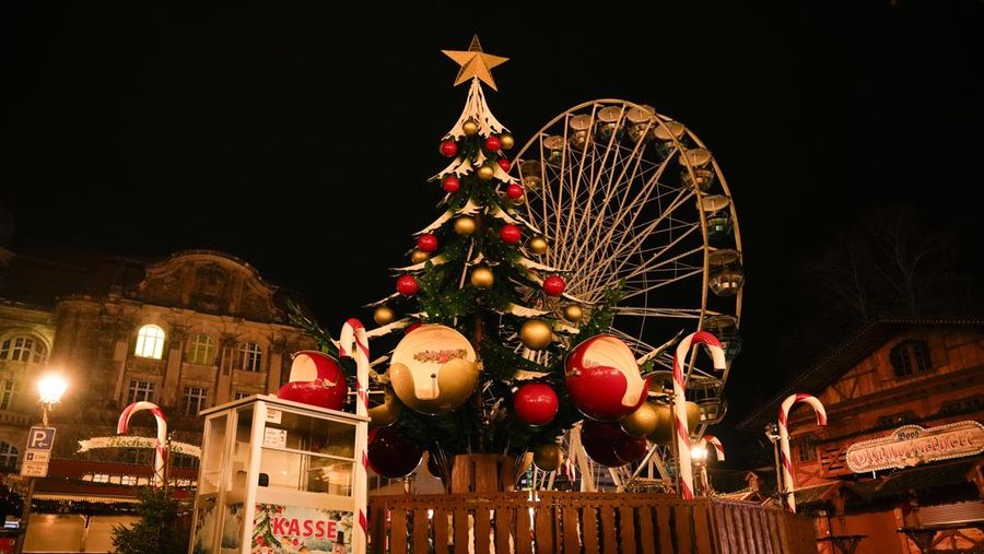 Police stand at a Christmas market in Magdeburg, Germany, early Saturday, Dec. 21, 2024, after a driver plowed into a group of people at the market late Friday. (Hendrik Schmidt/dpa via AP)