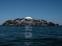 Pulau Migingo yang dihuni oleh penduduk yang sebagian besar mencari ikan nila di Danau Victoria di perbatasan Uganda dan Kenya.  (Photo by Yasuyoshi CHIBA / AFP/File Foto)