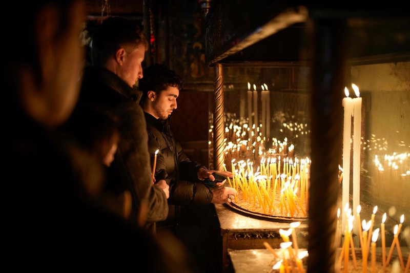 Nuns walk along the Church of the Nativity, traditionally believed to be the birthplace of Jesus, on Christmas Eve, in the West Bank city of Bethlehem, Tuesday, Dec. 24, 2024. (AP Photo/Matias Delacroix)