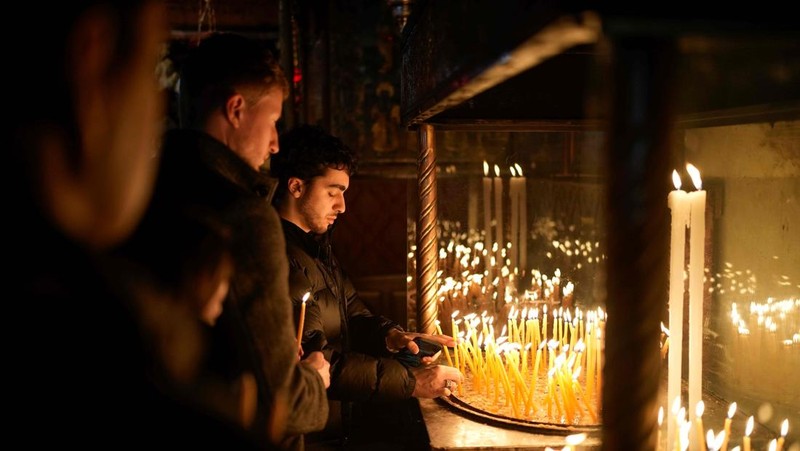 Nuns walk along the Church of the Nativity, traditionally believed to be the birthplace of Jesus, on Christmas Eve, in the West Bank city of Bethlehem, Tuesday, Dec. 24, 2024. (AP Photo/Matias Delacroix)