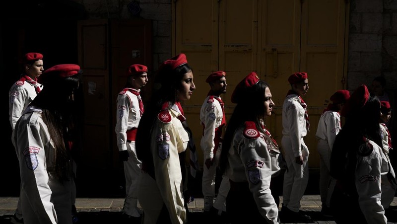 Nuns walk along the Church of the Nativity, traditionally believed to be the birthplace of Jesus, on Christmas Eve, in the West Bank city of Bethlehem, Tuesday, Dec. 24, 2024. (AP Photo/Matias Delacroix)