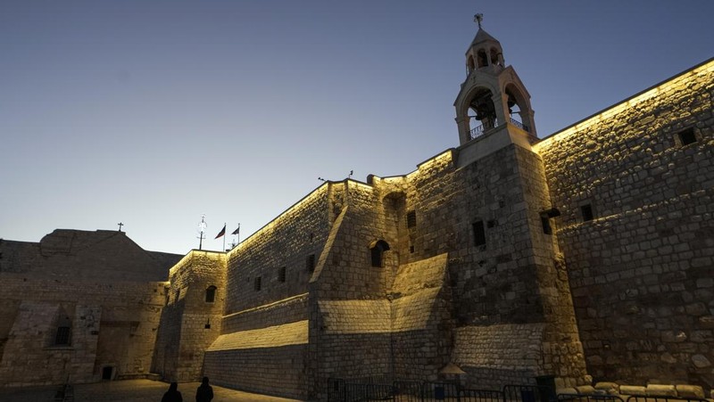 Nuns walk along the Church of the Nativity, traditionally believed to be the birthplace of Jesus, on Christmas Eve, in the West Bank city of Bethlehem, Tuesday, Dec. 24, 2024. (AP Photo/Matias Delacroix)