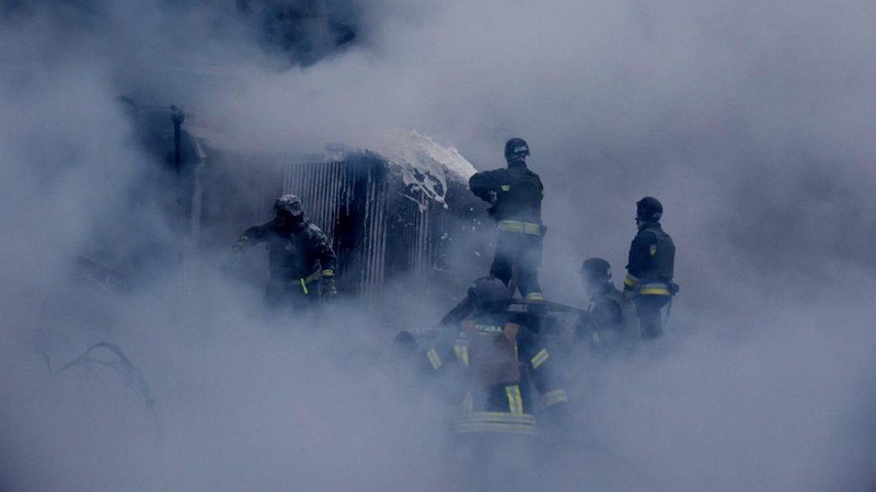 Firefighters work at a site of a Russian missile strike, amid Russia's attack on Ukraine, in Dnipropetrovsk region, Ukraine December 25, 2024.  Press service of the State Emergency Service of Ukraine in Dnipropetrovsk region/Handout via REUTERS ATTENTION EDITORS - THIS IMAGE HAS BEEN SUPPLIED BY A THIRD PARTY. WATERMARK FROM SOURCE.