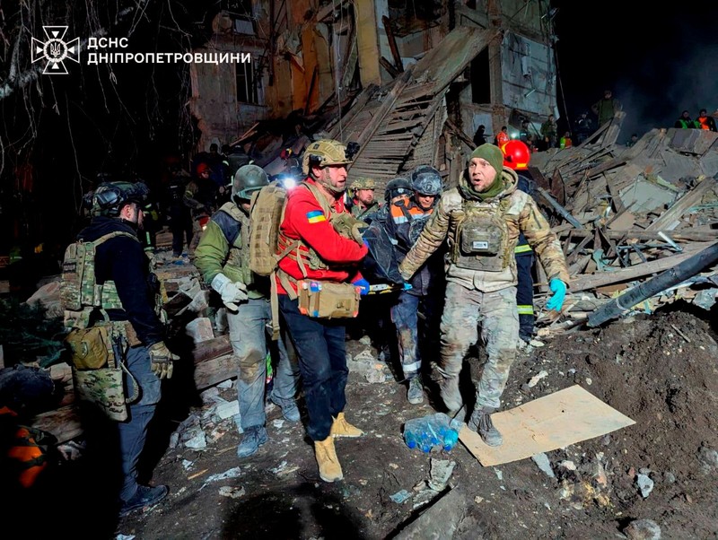 UKRAINE-CRISIS/ATTACK-DNIPROPETROVSK REGION Firefighters work at a site of a Russian missile strike, amid Russia's attack on Ukraine, in Dnipropetrovsk region, Ukraine December 25, 2024. Press service of the State Emergency Service of Ukraine in Dnipropetrovsk region/Handout via REUTERS ATTENTION EDITORS - THIS IMAGE HAS BEEN SUPPLIED BY A THIRD PARTY. WATERMARK FROM SOURCE.