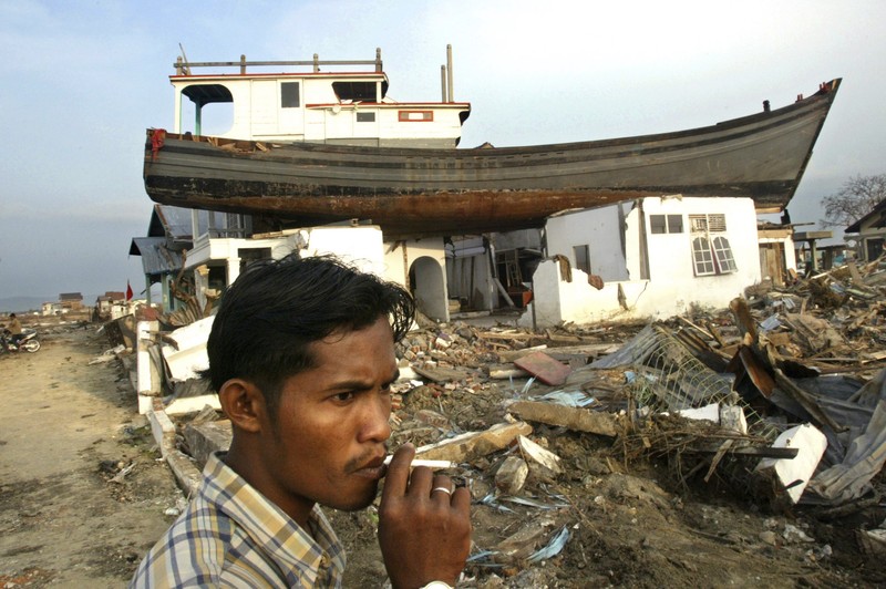 Rumah-rumah yang hancur terlihat dalam pemandangan udara kota Meulaboh di provinsi Aceh, Indonesia, yang diratakan oleh gelombang pasang, pada hari Sabtu, 1 Januari 2005. (AP Photo/Dudi Anung, File) Rumah-rumah yang hancur terlihat dalam pemandangan udara kota Meulaboh di provinsi Aceh, Indonesia, yang diratakan oleh gelombang pasang, pada hari Sabtu, 1 Januari 2005. (AP Photo/Dudi Anung, File)