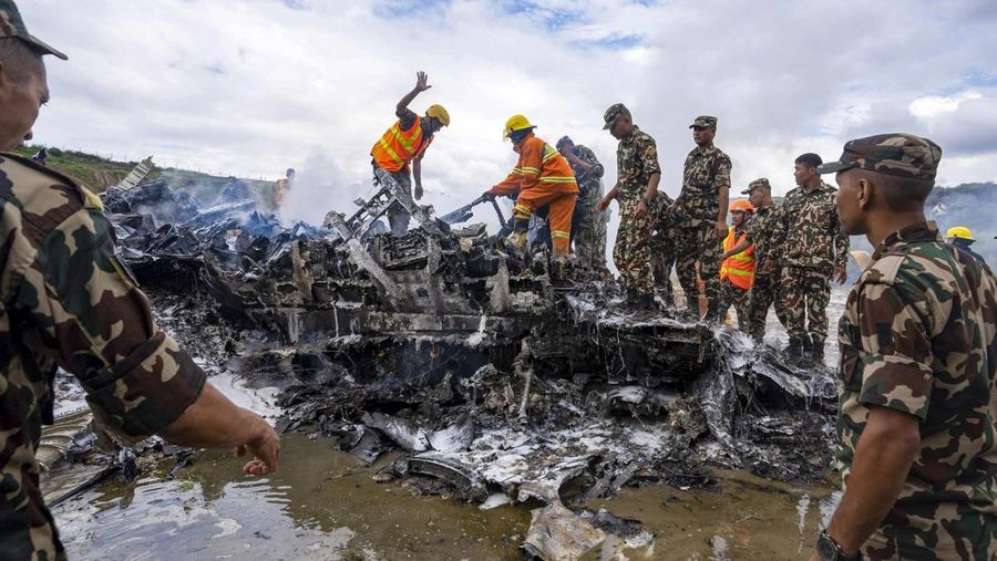 This aerial photo show the burn-out Japan Airlines plane at Haneda airport on Wednesday, Jan. 3, 2024, in Tokyo, Japan. The large passenger plane and a Japanese coast guard aircraft collided on the runway at Tokyo's Haneda Airport on Tuesday and burst into flames, killing several people aboard the coast guard plane, officials said. (Kyodo News via AP)