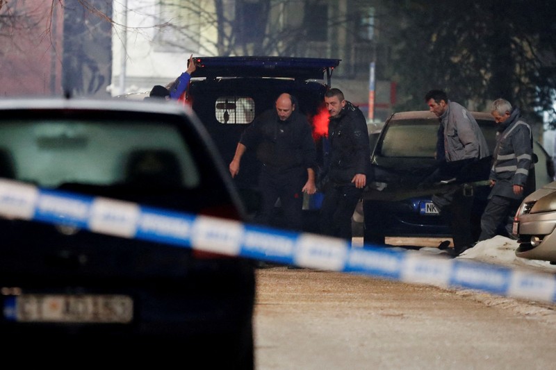 MONTENEGRO-SHOOTING/ Workers carry a body after a gunman opened fire and killed several people in a restaurant in Cetinje, Montenegro, January 1, 2025. REUTERS/Stevo Vasiljevic TPX IMAGES OF THE DAY