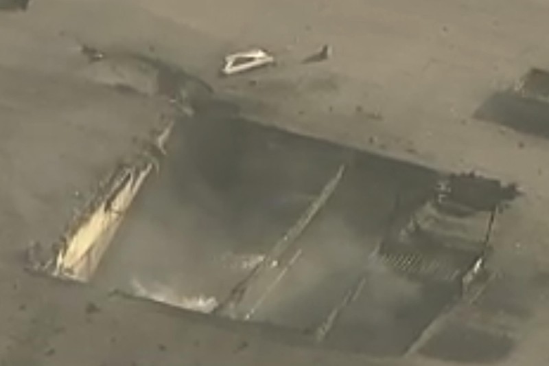 This image taken from video, shows a small plane about to crash into a commercial building in Fullerton, Calif. on Thursday, Jan. 2, 2025. (RUCCI FORGED via AP)