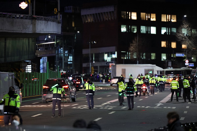 Vehicles believed to be of investigators from the Corruption Investigation Office for High-ranking Officials arrive at the impeached South Korean President Yoon Suk Yeol's official residence as Yoon faces potential arrest after a court-approved warrant, in Seoul, South Korea, January 3, 2025.     Yonhap/via REUTERS  ATTENTION EDITORS - THIS IMAGE HAS BEEN SUPPLIED BY A THIRD PARTY. NO RESALES. NO ARCHIVE. SOUTH KOREA OUT. NO COMMERCIAL OR EDITORIAL SALES IN SOUTH KOREA.