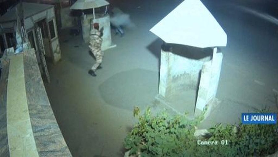 This video grab from a CCTV video of the presidential complex obtained by AFPTV from Tele Tchad on January 9, 2025 shows a soldier firing at gunmen attempting to storm the presidential complex in Chad's capital N'Djamena on January 8, 2025. The government later said 19 people were killed in the fighting, of which 18 were members of the 24-strong commando unit that launched the assault. (Photo by Tele Tchad / AFP) / RESTRICTED TO EDITORIAL USE - MANDATORY CREDIT