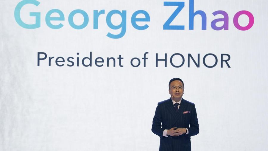 George Zhao, President of phone brand Honor speaks on stage during the global launch of the new Honor 20 series of phones in London, Tuesday, May 21, 2019. The phone is made by the Chinese company Huawei and the top of the range model Honor 20 Pro will sell for around 599 euros when released. (AP Photo/Alastair Grant)