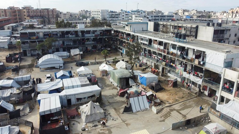 This drone photo shows displaced Palestinians returning to Rafah, a day after the ceasefire deal between Israel and Hamas came into effect, Gaza Strip, Monday, Jan. 20, 2025. (AP Photo/Jehad Alshrafi)