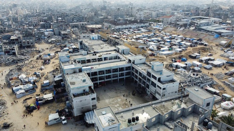 This drone photo shows displaced Palestinians returning to Rafah, a day after the ceasefire deal between Israel and Hamas came into effect, Gaza Strip, Monday, Jan. 20, 2025. (AP Photo/Jehad Alshrafi)