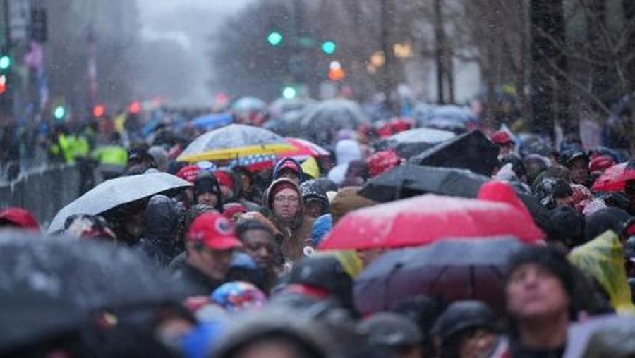 WASHINGTON, DC - JANUARY 19: Supporters gather in the snow outside the Capital One Arena where Donald Trump is holding his victory rally on January 19, 2025 in Washington, DC. U.S. President-elect Donald Trump and Vice President-elect JD Vance will be sworn in on January 20.   Christopher Furlong/Getty Images/AFP (Photo by Christopher Furlong / GETTY IMAGES NORTH AMERICA / Getty Images via AFP)