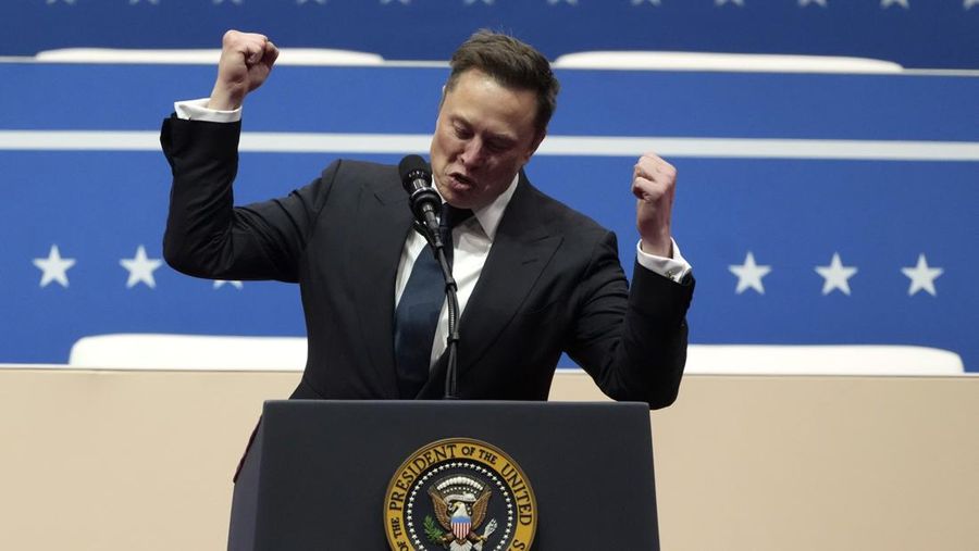 Elon Musk speaks at an indoor Presidential Inauguration parade event in Washington, Monday, Jan. 20, 2025. (AP Photo/Matt Rourke)