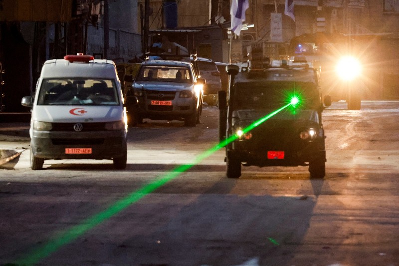 Kendaraan militer Israel melaju di jalan selama serangan Israel, di Jenin, di Tepi Barat yang diduduki Israel, 21 Januari 2025. Kendaraan militer Israel melaju di jalan selama serangan Israel, di Jenin, di Tepi Barat yang diduduki Israel, 21 Januari 2025. (REUTERS/Raneen Sawafta)