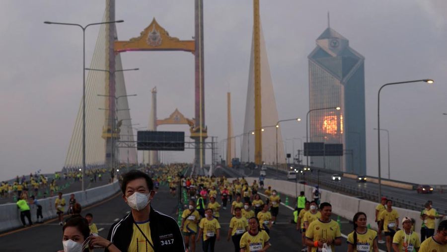 People attend a running event on the newly constructed cable-stayed Rama X Bridge or 