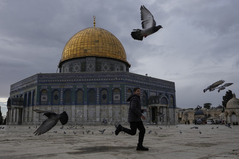 Rain clouds loom over the Dome of the Rock Mosque in the Al-Aqsa Mosque compound in the Old City of Jerusalem, Friday, Jan. 24, 2025. (AP Photo/Mahmoud Illean)