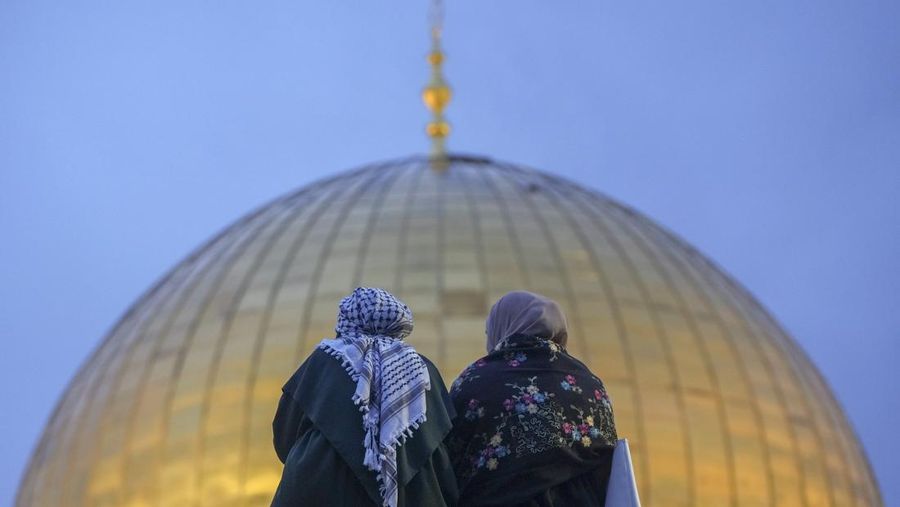 Palestinians gather for Eid al-Fitr prayers by the Dome of the Rock shrine in the Al Aqsa Mosque compound in Jerusalem's Old City, Wednesday, April 10, 2024. The holiday marks the end of the holy month of Ramadan, when devout Muslims fast from sunrise to sunset. (AP Photo/Mahmoud Illean)