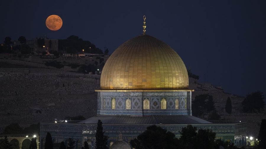 Rain clouds loom over the Dome of the Rock Mosque in the Al-Aqsa Mosque compound in the Old City of Jerusalem, Friday, Jan. 24, 2025. (AP Photo/Mahmoud Illean)