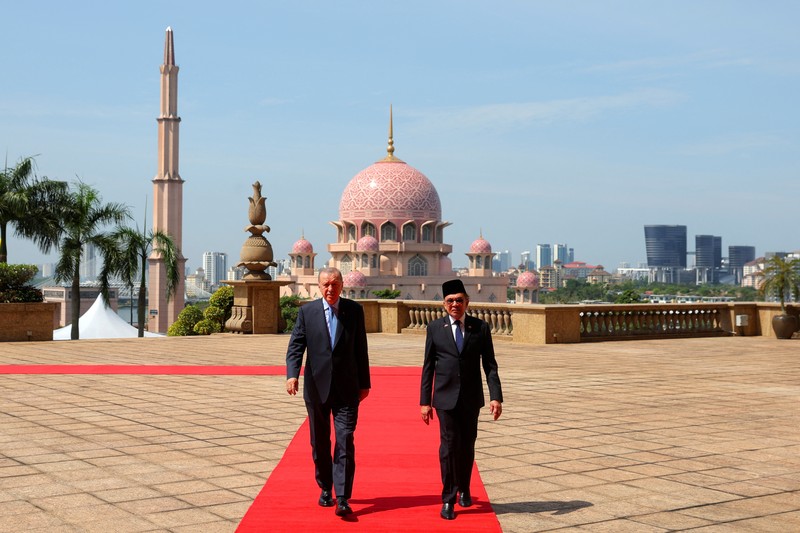 President of Turkey Recep Tayyip Erdogan walks with Malaysian Prime Minister Anwar Ibrahim, in Putrajaya, Malaysia, 11 February 2025.   FAZRY ISMAIL/Pool via REUTERS