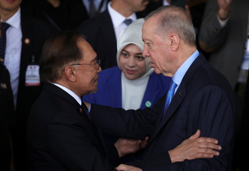 President of Turkey Recep Tayyip Erdogan walks with Malaysian Prime Minister Anwar Ibrahim, in Putrajaya, Malaysia, 11 February 2025.   FAZRY ISMAIL/Pool via REUTERS